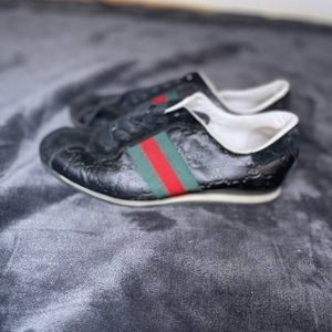 Black Gucci sneakers